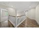 Second story hallway with hardwood floors and natural light at 1005 Keith Rd, Wake Forest, NC 27587