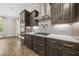 Well-appointed kitchen features a gas range, modern vent hood, and custom cabinetry at 1005 Keith Rd, Wake Forest, NC 27587