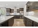 Gourmet kitchen featuring stainless steel appliances, custom cabinets, and subway tile backsplash at 1005 Keith Rd, Wake Forest, NC 27587