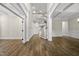 Spacious living room with high ceilings, an open staircase, decorative trim, and hardwood floors adding warmth and character at 1005 Keith Rd, Wake Forest, NC 27587