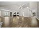 Bright open-concept living room with hardwood floors and architectural details open to a gourmet kitchen at 1005 Keith Rd, Wake Forest, NC 27587