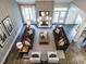 Open-concept living room with high ceilings, a chandelier, and neutral decor at 1005 Keith Rd, Wake Forest, NC 27587