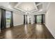 Spacious living room boasts hardwood floors and coffered ceilings at 1005 Keith Rd, Wake Forest, NC 27587