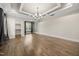 Living room features hardwood floors, coffered ceiling and ample natural light at 1005 Keith Rd, Wake Forest, NC 27587