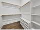 Well-organized walk-in closet with custom shelving and hanging rods at 1005 Keith Rd, Wake Forest, NC 27587