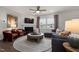 Cozy living room featuring a fireplace, comfortable seating, and a large area rug at 1017 Freestone Rd, Durham, NC 27703