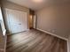 Bedroom featuring wood floors, trim, natural light, and a closet at 1063 Fairhaven Dr # 54, Mebane, NC 27302