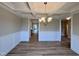 This dining room features coffered ceilings, chair rail, and hardwood floors at 1063 Fairhaven Dr # 54, Mebane, NC 27302