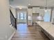 The kitchen features stainless appliances, white cabinets, and a center island at 1063 Fairhaven Dr # 54, Mebane, NC 27302