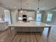 Modern kitchen featuring a large island, stainless steel appliances, and stylish pendant lighting at 1063 Fairhaven Dr # 54, Mebane, NC 27302