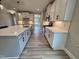 Well-lit kitchen with modern appliances and countertops seamlessly connected to the open living space at 1063 Fairhaven Dr # 54, Mebane, NC 27302