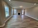 Bright and open living room with wood floors, a fireplace, and large windows for natural light at 1063 Fairhaven Dr # 54, Mebane, NC 27302