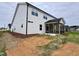 This home features a screened in porch, and a concrete patio in the backyard at 1063 Fairhaven Dr # 54, Mebane, NC 27302