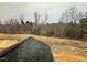 Newly installed roof overlooking wooded area and pond at 1063 Fairhaven Dr # 54, Mebane, NC 27302