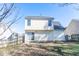 A view of the backyard with a small concrete patio and a wood fence at 117 Crabwall Ct, Holly Springs, NC 27540