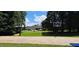 Community basketball court with two hoops and trees in the background at 117 Crabwall Ct, Holly Springs, NC 27540