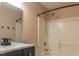 Bathroom featuring a shower-tub combo with modern fixtures and a dark vanity at 117 Crabwall Ct, Holly Springs, NC 27540