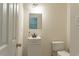 Simple bathroom with toilet and sink at 117 Crabwall Ct, Holly Springs, NC 27540