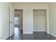 Bedroom featuring gray wood floors, neutral walls, and a walk-in closet at 117 Crabwall Ct, Holly Springs, NC 27540