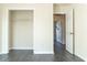 Bedroom featuring gray wood floors, neutral walls, and walk-in closet at 117 Crabwall Ct, Holly Springs, NC 27540