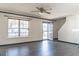 Bright living room with hardwood floors, large windows, and a welcoming entryway at 117 Crabwall Ct, Holly Springs, NC 27540