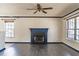 Cozy living room featuring a fireplace, hardwood floors, and neutral color palette at 117 Crabwall Ct, Holly Springs, NC 27540