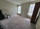 Spacious bedroom featuring neutral walls, carpet flooring, and a table lamp for cozy lighting at 1317 Justin Oaks Ct, Willow Springs, NC 27592