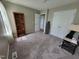 Inviting bedroom featuring neutral walls, carpet, a bookcase, and convenient closet doors at 1317 Justin Oaks Ct, Willow Springs, NC 27592
