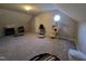 A versatile bonus room featuring vaulted ceilings, carpet, and octagonal window at 1317 Justin Oaks Ct, Willow Springs, NC 27592