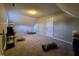 Spacious bonus room with angled ceilings, neutral paint, carpet, and natural light at 1317 Justin Oaks Ct, Willow Springs, NC 27592