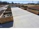 Concrete walkway through the raised beds in the community garden at Beech Bluff County Park at 1317 Justin Oaks Ct, Willow Springs, NC 27592