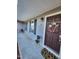 Inviting front porch featuring neutral siding, a decorative wreath, and a welcome mat at 1317 Justin Oaks Ct, Willow Springs, NC 27592