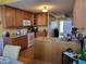 Functional kitchen with oak cabinets, granite counters, and an island for additional prep space at 1317 Justin Oaks Ct, Willow Springs, NC 27592