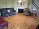 Comfortable living room with hardwood floors, a fireplace, and a cozy seating area at 1317 Justin Oaks Ct, Willow Springs, NC 27592