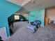 Spacious living area with unique blue walls, and a comfortable seating area with a Carolina blanket at 1317 Justin Oaks Ct, Willow Springs, NC 27592