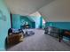 Bright living area featuring unique blue walls, carpet, and a vanity area at 1317 Justin Oaks Ct, Willow Springs, NC 27592