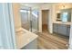 Bright bathroom with a tiled shower, double sink vanity, and modern finishes at 132 Muskogee Rd # 58, Angier, NC 27501