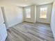 Clean bedroom features hard surface floors, two windows and a walk-in closet at 132 Muskogee Rd # 58, Angier, NC 27501