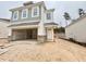 Two-story home featuring a two-car garage, white siding, shingle details, and a welcoming front door at 132 Muskogee Rd # 58, Angier, NC 27501