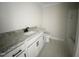 Modern bathroom featuring a sleek vanity with granite countertops and elegant fixtures at 1663 Keith Hills Rd, Lillington, NC 27546