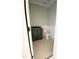 Powder room featuring a toilet and vanity with dark green cabinet and black countertop on the main floor at 1663 Keith Hills Rd, Lillington, NC 27546