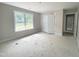 Spacious bedroom featuring a large window and ample closet space at 1663 Keith Hills Rd, Lillington, NC 27546