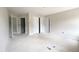 Large bedroom featuring multiple doorways and ample closet space at 1663 Keith Hills Rd, Lillington, NC 27546