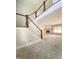 Bright living room with staircase and a fireplace featuring an elegant marble surround at 1663 Keith Hills Rd, Lillington, NC 27546