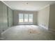 A new room with detailed trim and large windows at 1663 Keith Hills Rd, Lillington, NC 27546