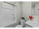 Bright bathroom featuring a shower-tub combo, toilet and modern vanity at 17 Donatella Way, Angier, NC 27501