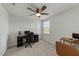 Well-lit bedroom with a ceiling fan, a window and a neutral carpet at 17 Donatella Way, Angier, NC 27501