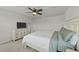 This spacious bedroom features a ceiling fan and a dresser with a TV on top at 17 Donatella Way, Angier, NC 27501