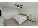 Bright bedroom features a ceiling fan and matching dresser and nightstand at 17 Donatella Way, Angier, NC 27501