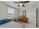 Cozy bedroom with a ceiling fan, window, and dresser at 17 Donatella Way, Angier, NC 27501